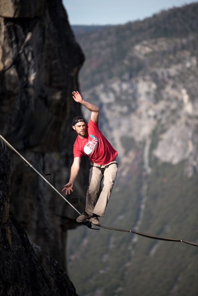 A man balances across a tightrope in the mountains. This could represent the stress of anxiety that anxiety treatment in Atlanta, GA can address. Learn more about online anxiety treatment in Atlanta, GA, panic attack treatment in Atlanta, GA, and more. 
