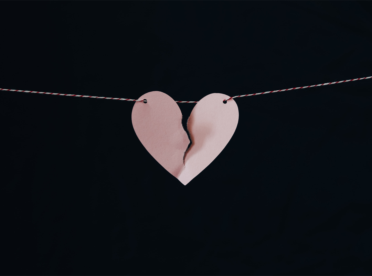 A close up paper heart with a tear down the middle. This could symbolize the pain grief counseling in Atlanta, GA can help overcome. Contact a grief counselor in Atlanta, GA to learn more about online grief counseling and more.