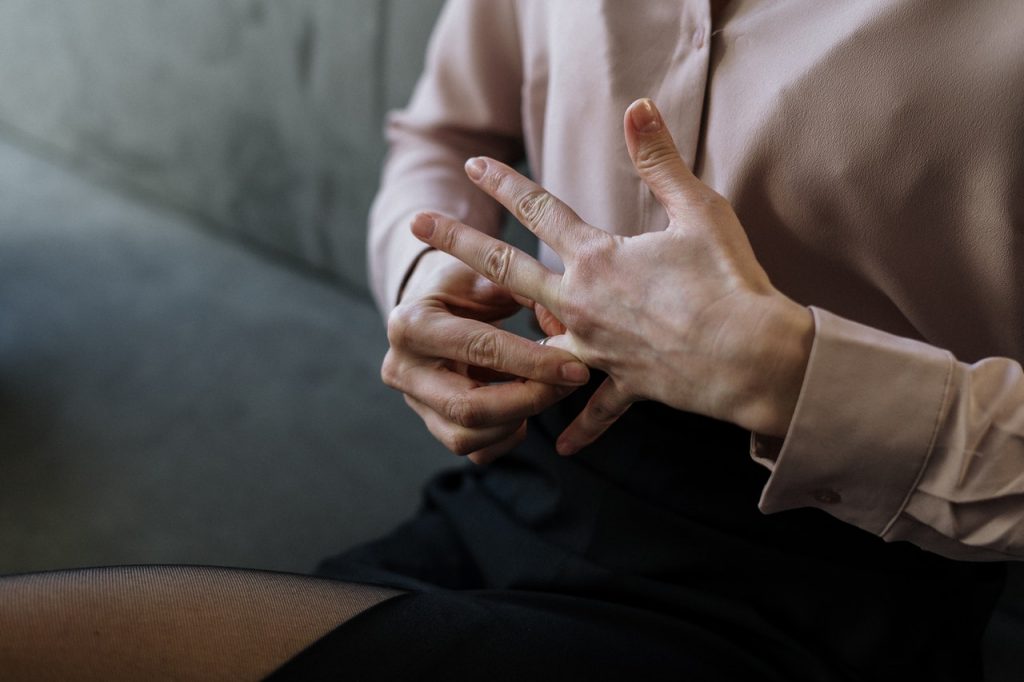A close up of a person pulling at their wedding ring. Learn how grief can effect your relationships and the support a grief counselor in Atlanta, GA can offer. Learn more about grief counseling in Atlanta, GA today.